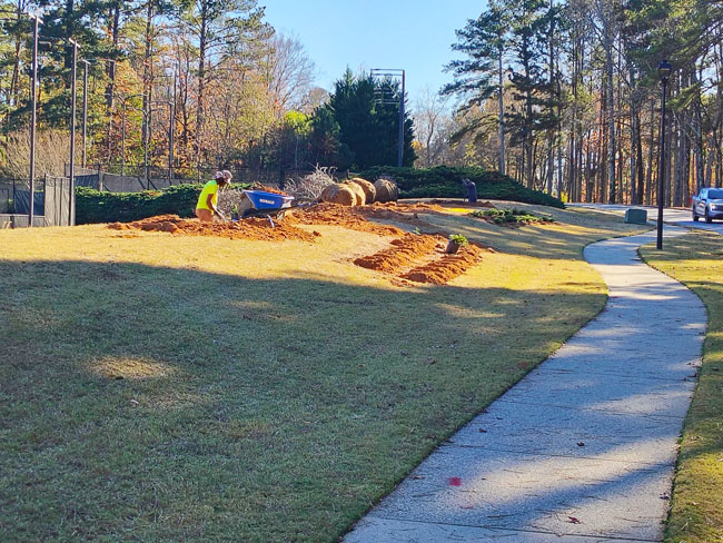 In progress commercial lawn care work