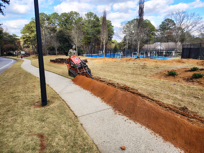 In progress commercial lawn care work